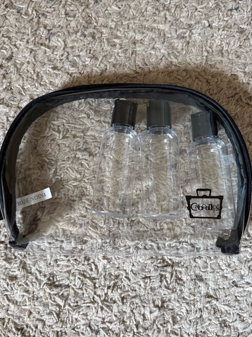 Caboodles brand travel bag with bottles